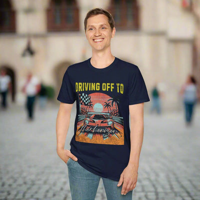 "Smiling man wearing a Driving Off To Horizon graphic t-shirt with sunset and car design, perfect for casual comfort."