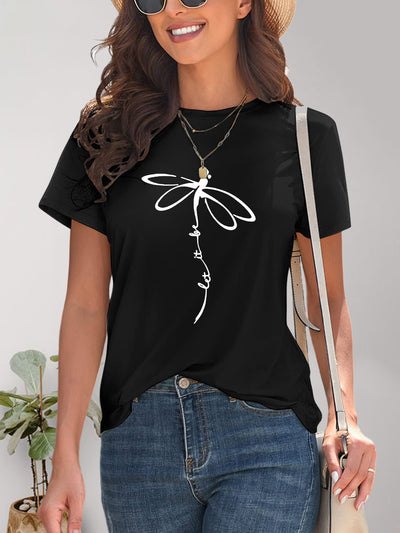 Woman wearing black dragonfly graphic round neck short sleeve T-shirt with blue jeans and sunglasses.