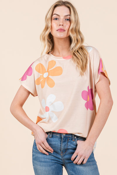 Woman wearing BOMBOM Floral Short Sleeve T-Shirt with colorful flower print, paired with jeans for a casual, stylish look.