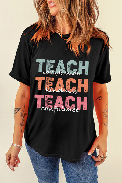 Woman wearing black round neck short sleeve t-shirt with "Teach Compassion, Teach Kindness, Teach Confidence" letter graphic design