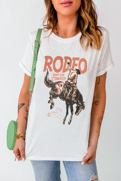 Woman wearing cowboy graphic round neck short sleeve T-shirt with "Rodeo" design, casual fashion with jeans and crossbody bag.