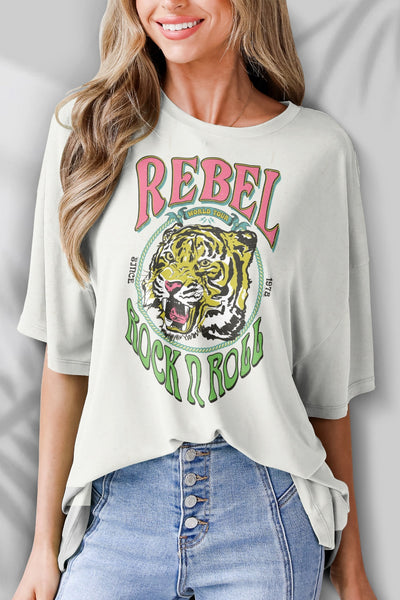 Woman wearing Rebel Rock n Roll graphic t-shirt in light fabric with round neck and half sleeves.