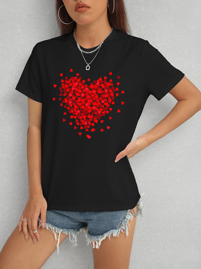 Woman wearing heart design round neck short sleeve black t-shirt paired with denim shorts.